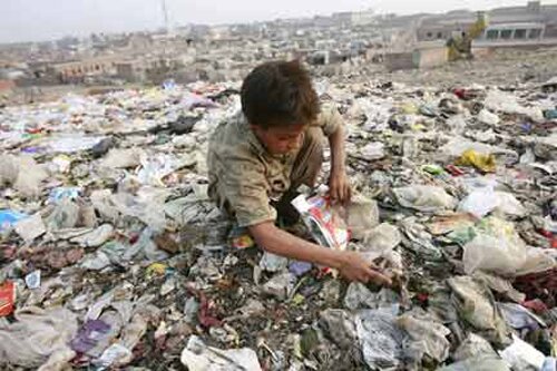 Poverty facts: kid with garbage
